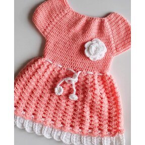 Crochet peach baby dress set with colorful trim